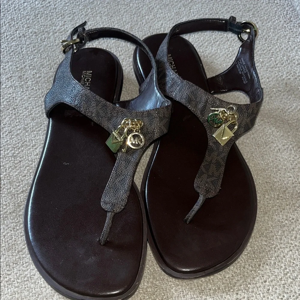 Michael Kors Suki T-Strap Brown Logo Sandals with Gold Charms